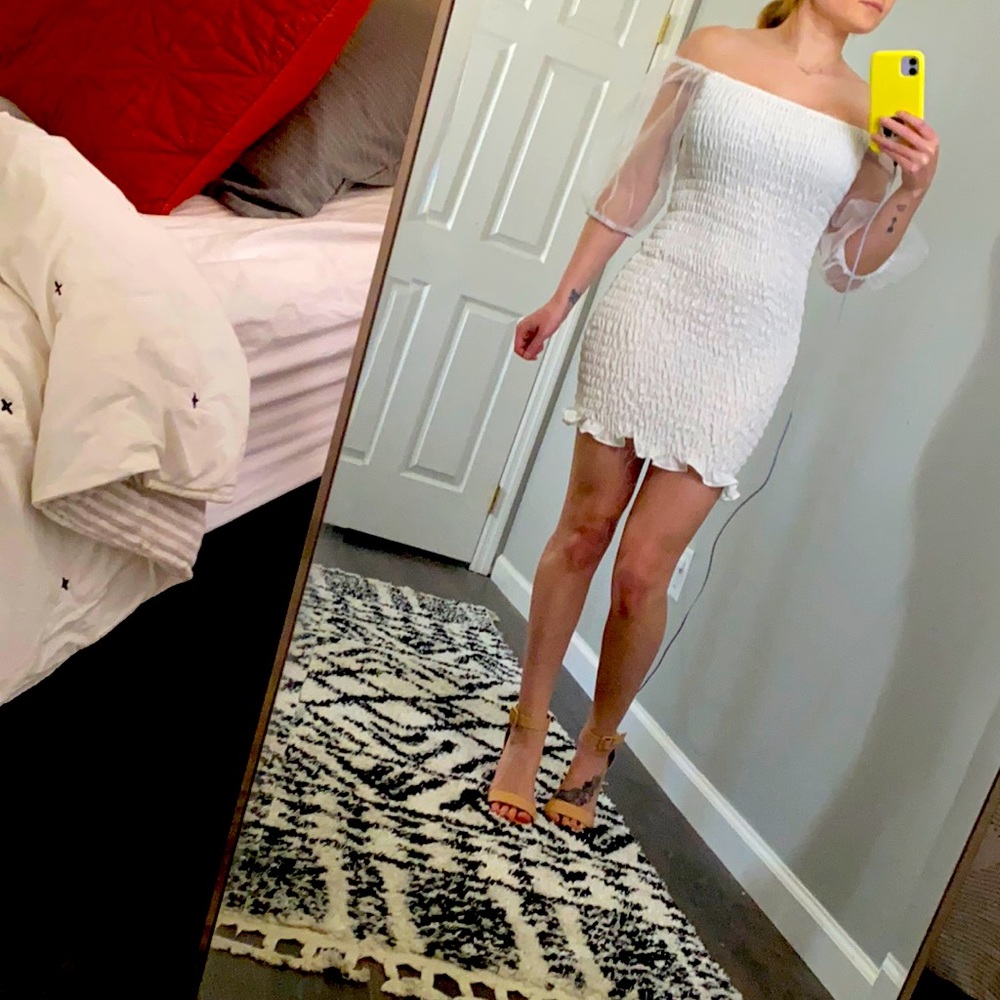 White scrunch dress with sheer poof sleeves.
